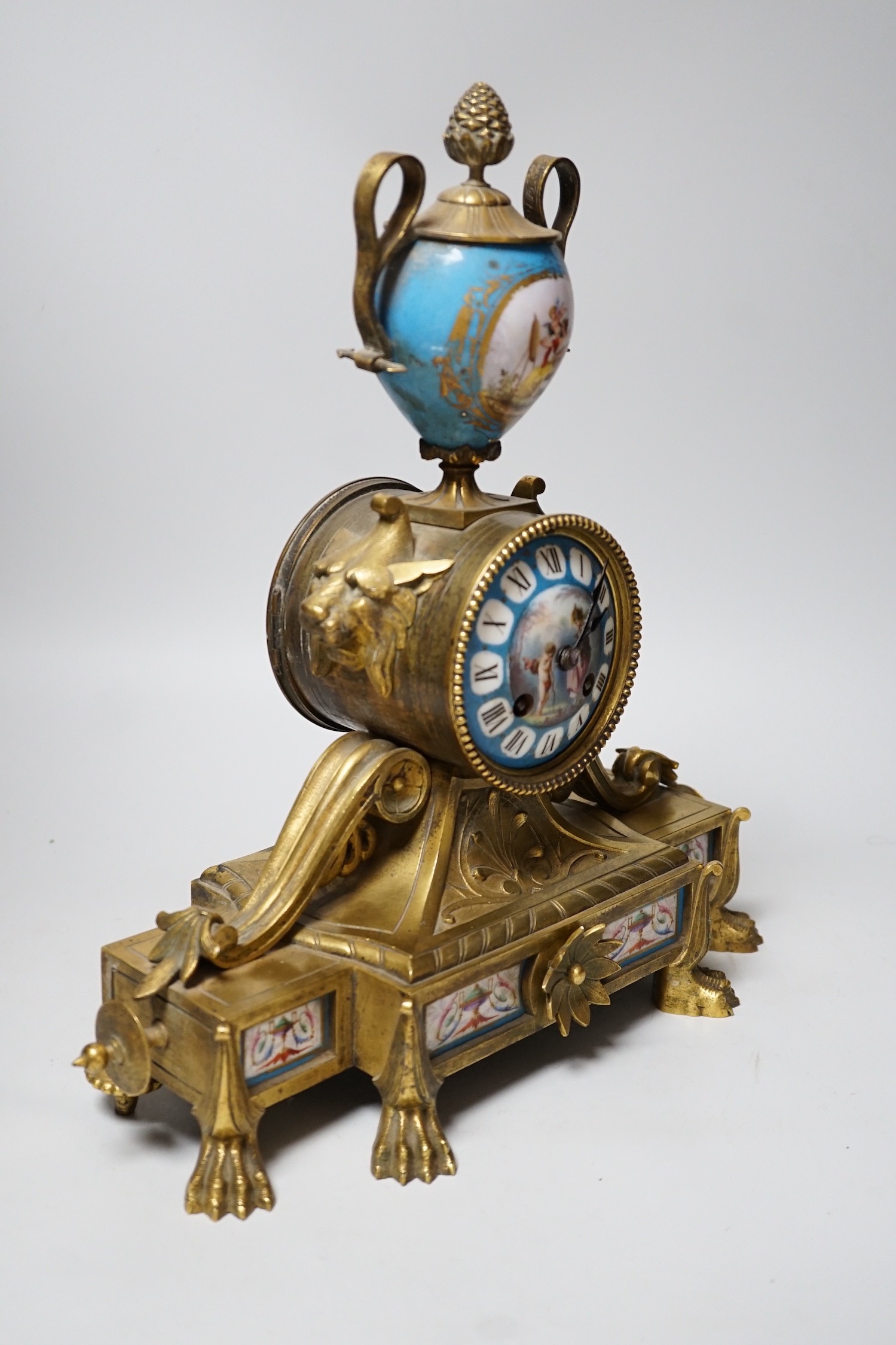 A Sevres style porcelain mounted ormolu mantel clock, 36cms high